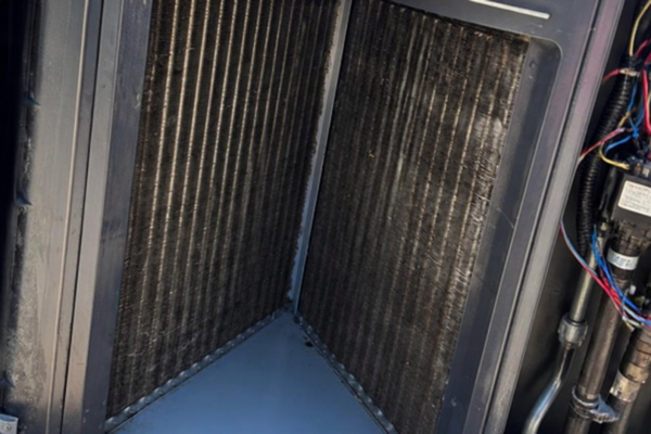 HVAC coil after visible dirt and debris were removed during service